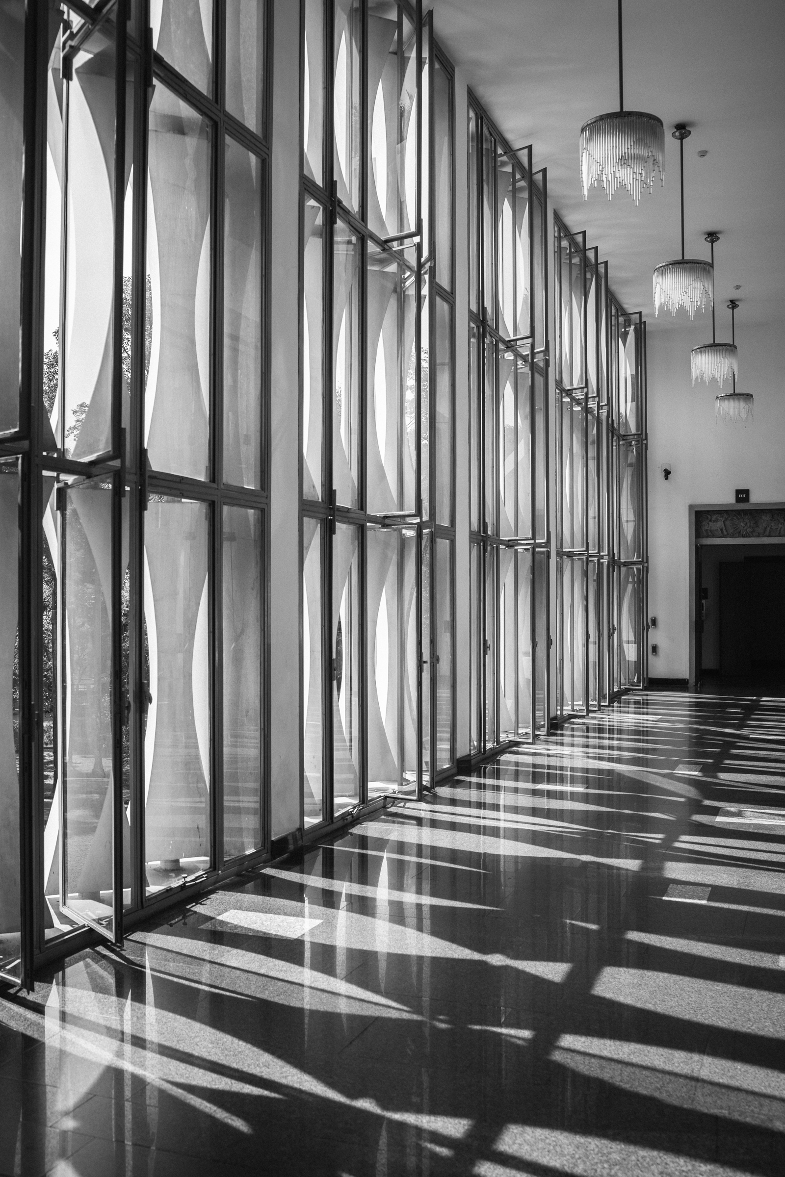 Black and white hallway with sunlight and shadows, architectural light study for remodeling and renovation design